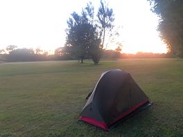Nice view of the sunset behind the trees and lots of space to pitch.