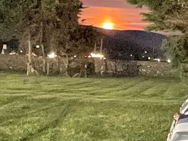 Strawberry moon over the hills