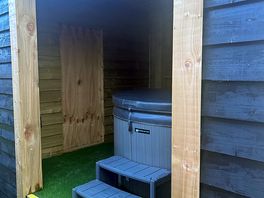 Enclosed hot tub on pitch