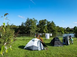 Grass pitches by the river