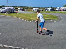 Scooting on the old karting track.
