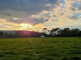 View from tent watching sun go down