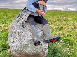 My daughter and rosie sitting on the last standing stone which is the same age as stonehenge.