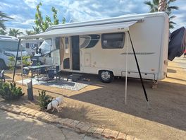 Pitch 59 next to shower blocks ,shop and bar
