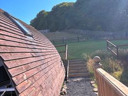 Bank to showers/kitchen/bbq area and few more pods