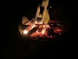 Camp fire at river view