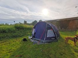 Sunrise over the tent and indoor arena