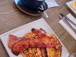 Streak bacon, maple syrup buttermilk pancakes and oat milk latte
