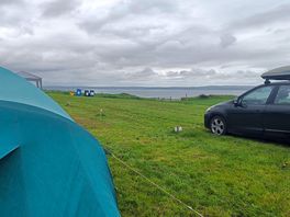 View of tent on upper pitches looking towards the gower