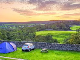 Grass pitches with views of the countryside