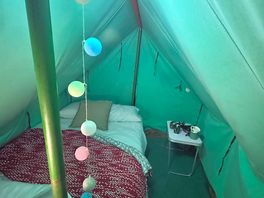Inside of the canvas tent - double bed is very comfy and there’s plenty of room for a couple