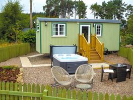 Exterior of the shepherd's hut showing hot tub
