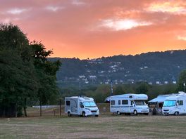 View of the sun setting behind the british camp