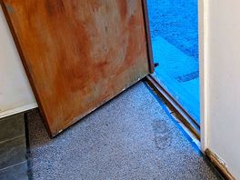 Worn out door scruffy mat