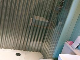 Toilet with shower.
