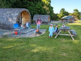 Outside cooking, shower blocks and oak pod in the background