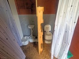 Shower curtains as doors providing no privacy or comfort.