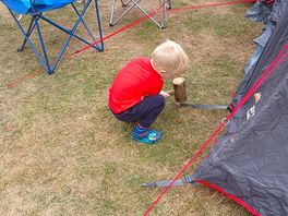 Ellis helping put up the tent