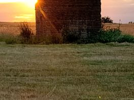 Sunset behind the stone shed