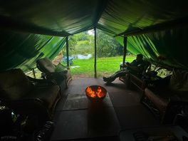 Outside but sheltered from the rain
