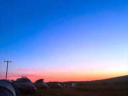 View from the back of the field at sundown. facing the ocean.
