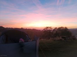 Gorgeous sunset. plenty on picnic tables dotted around too.