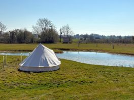 Bell tent by the pond