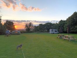 Evening sunset over the hills in the distance