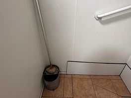 The shower, with mop and bucket