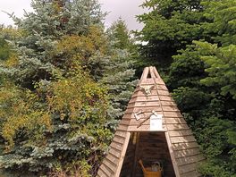 Firewood and beach toys tepee