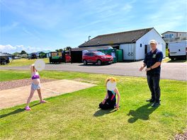 Enjoying the space on our pitch to sunbathe or play games. short walk to local beach