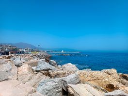 The walk along towards the marina .