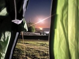 Moon over sea from tent