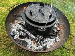Cooking on an open fire.