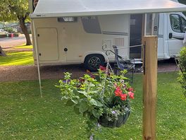 Our pitch under a willow tree , the shade was welcome. hardstanding with a good area of grass