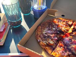 Pizza made on site and a glass of wine