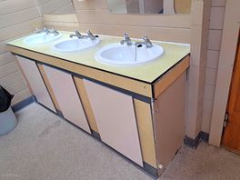 Broken sinks in toilets that constantly stink.