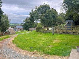 From orchard pod towards communal area and bathrooms