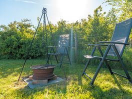 Firepit and chairs at the bell tent
