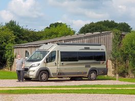 Campervan on fully serviced hardstanding pitch.