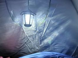 Inside the tent at night with our solar lamp. 😍