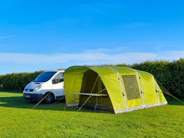 Our pitched tent and battle bus