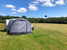 Flat unmarked pitches. wide open space with fantastic views