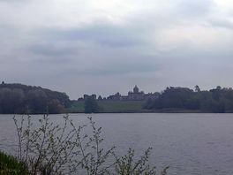A walk along the lakeside with views into the estate.