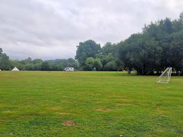 Campsite with a little forest play area in the middle
