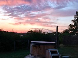 Hot tub with a sunset view