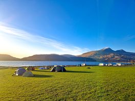 Tent field at sunset