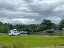 View of camper with canal behind