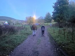 Walk through park at night.