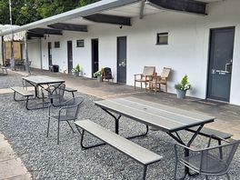 View of the toilet/shower area and the cafe/camp shop that is open in the mornings.